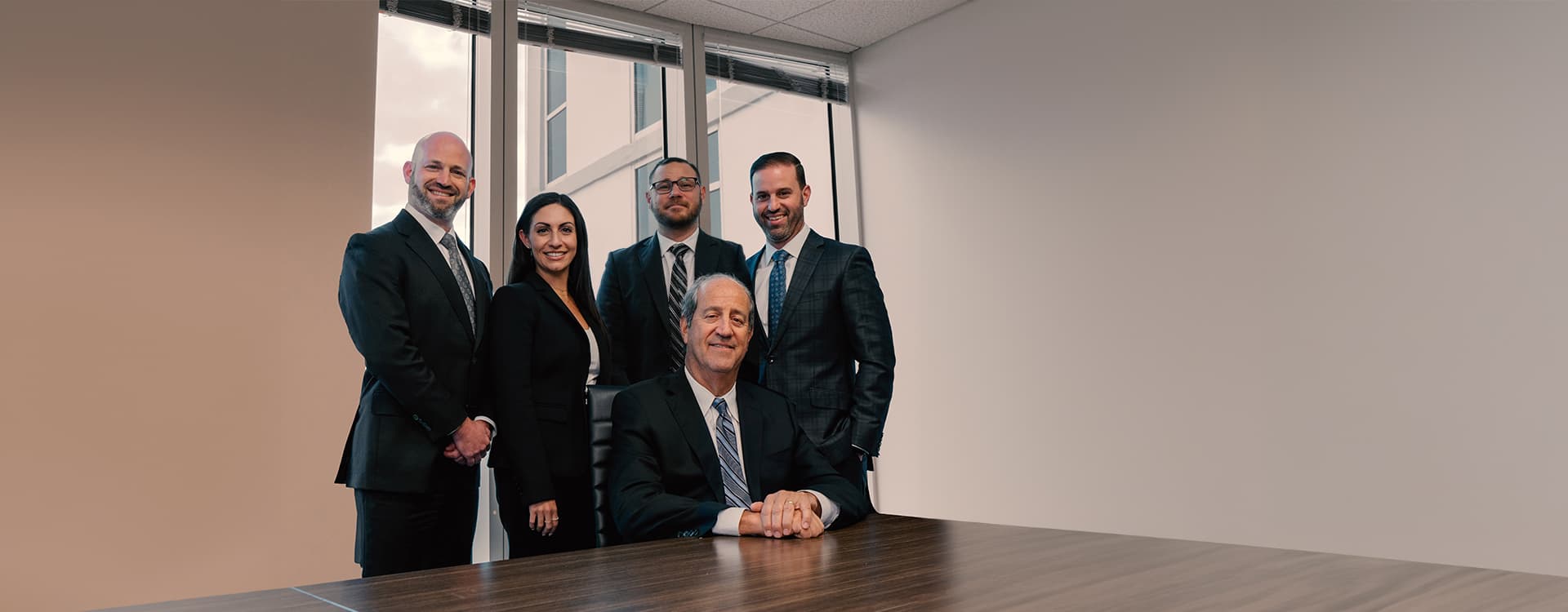 The attorneys of Gold & Gold, P.A. in their conference room